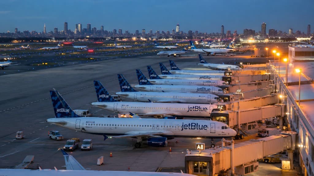 Airline fleet parked at airport gates, representing operational decision intelligence infrastructure for airlines